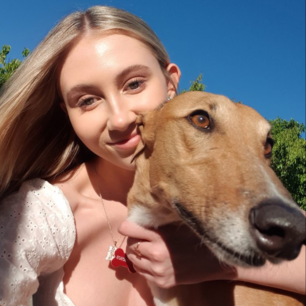 Maddie with her Greyhound pet